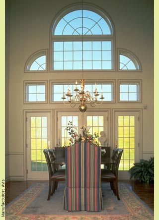A sublime Palladian window frames this dining room